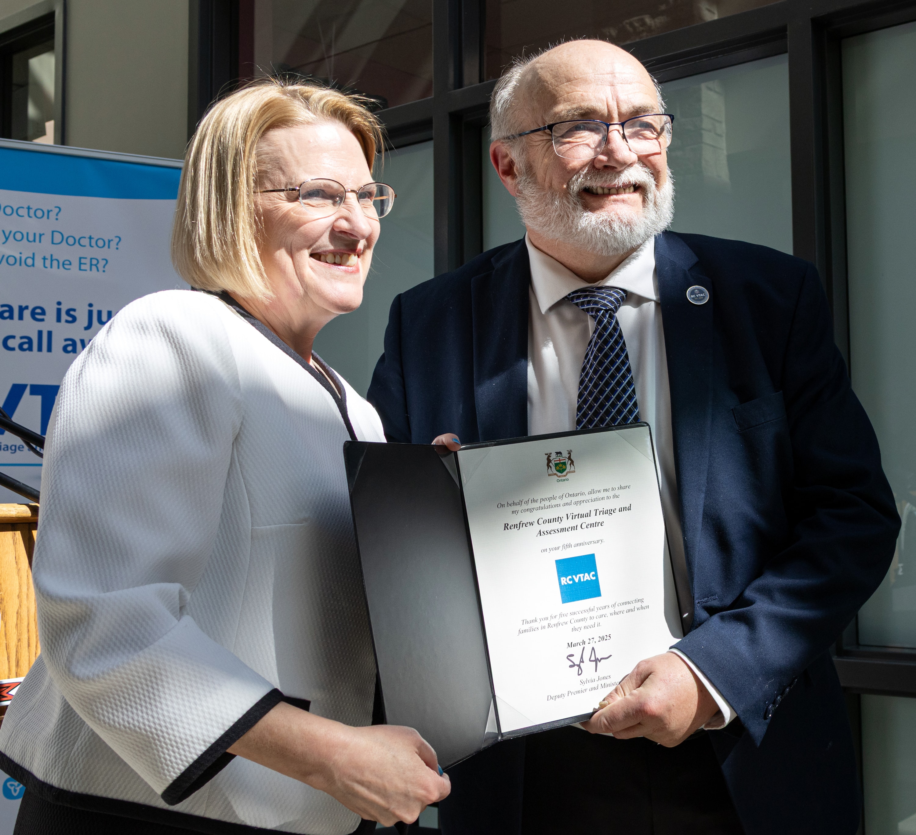 Peter Emon receiving RCVTAC fifth anniversary commendation from Health Minister Sylvia Jones